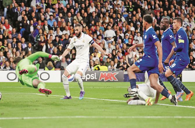 Karim Benzema scores the first goal for his team Real Madrid against Chelsea.